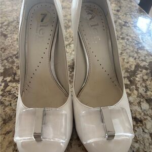 Jessica Simpson Cream Patent Pumps with Clear Bow Accent